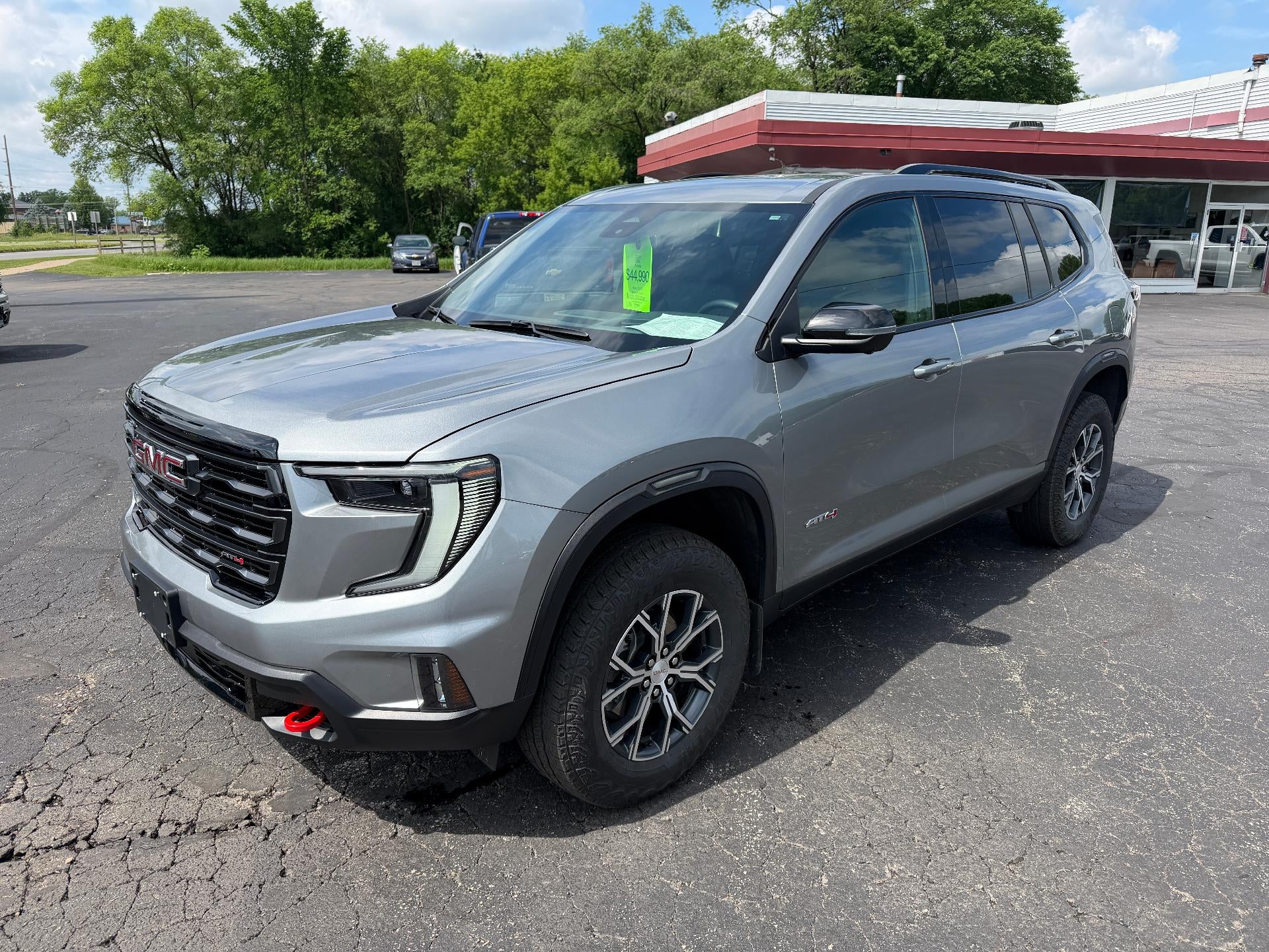 2024 GMC Acadia AT4 in Sterling Metallic — front three-quarter view