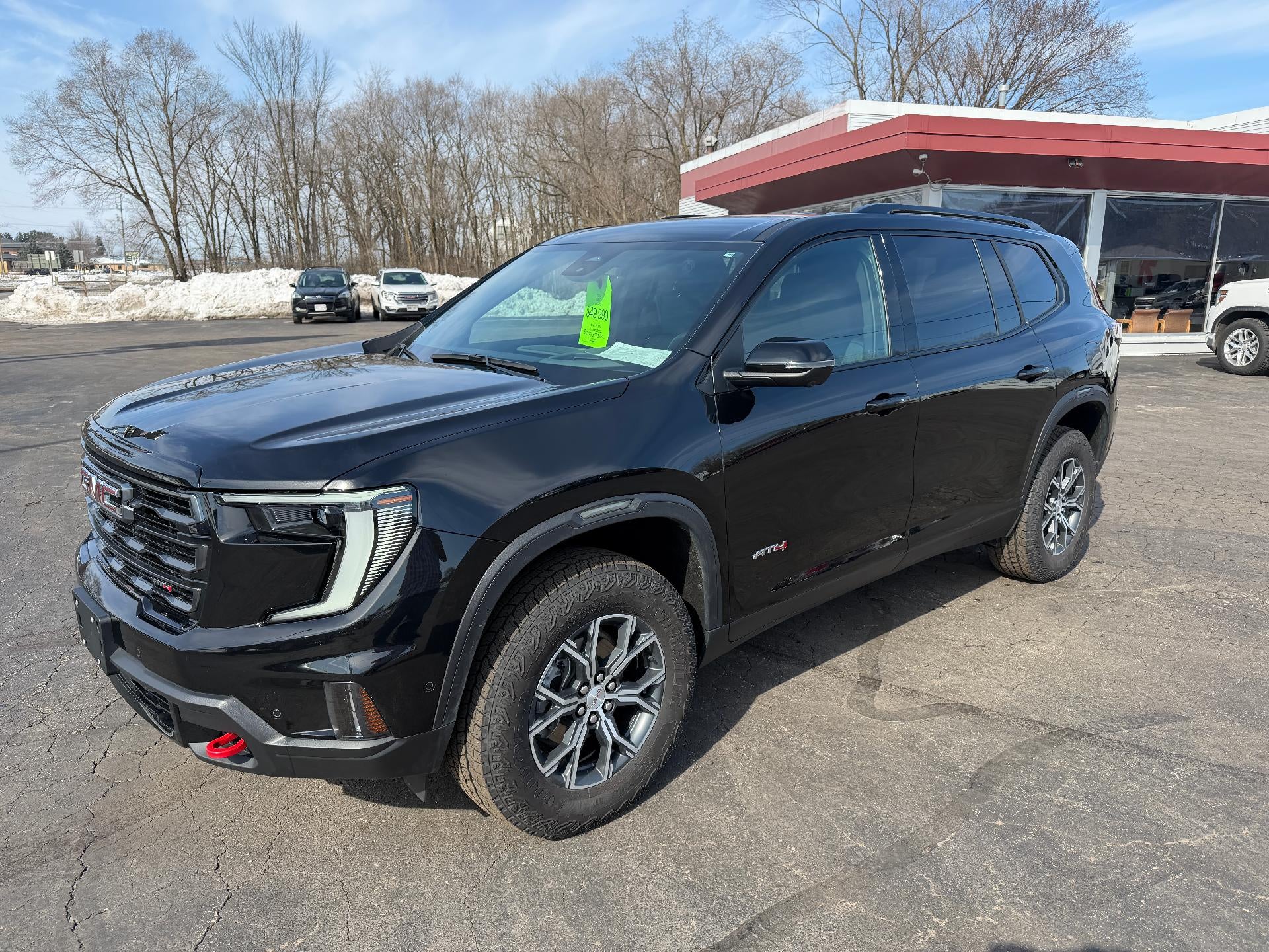 2024 GMC Acadia AT4 in Ebony Twilight Metallic — front three-quarter view