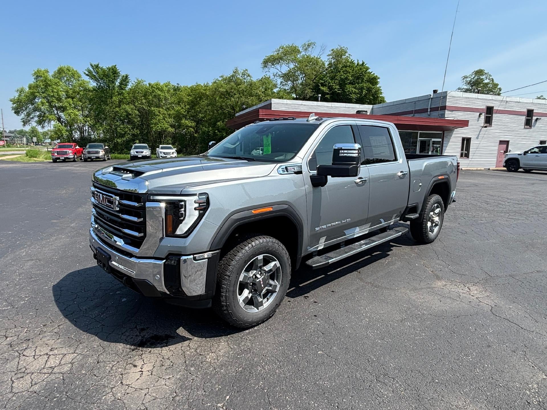 2025 GMC Sierra 2500 HD SLT in Sterling Metallic — front three-quarter view